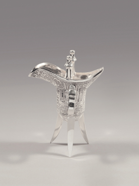 Jue–shaped cup 
Cast, chased and polished sterling silver
Hong Kong, Wai Kee Jewellers Ltd., 1980s
Stamped with Wai Kee trademark and collector’s mark
Loan from the Estate of Kwan Sai Tak